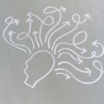 Abstract illustration of a human head with multiple arrows coming out, representing thoughts or brain activity.